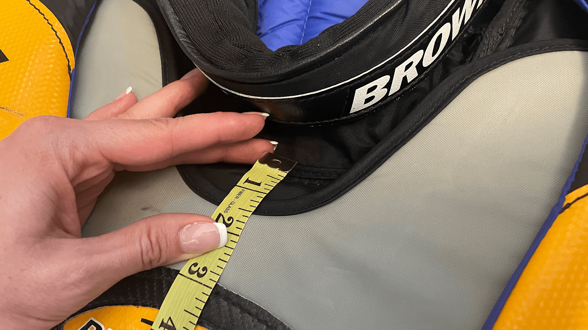 Measuring tape on chest protector