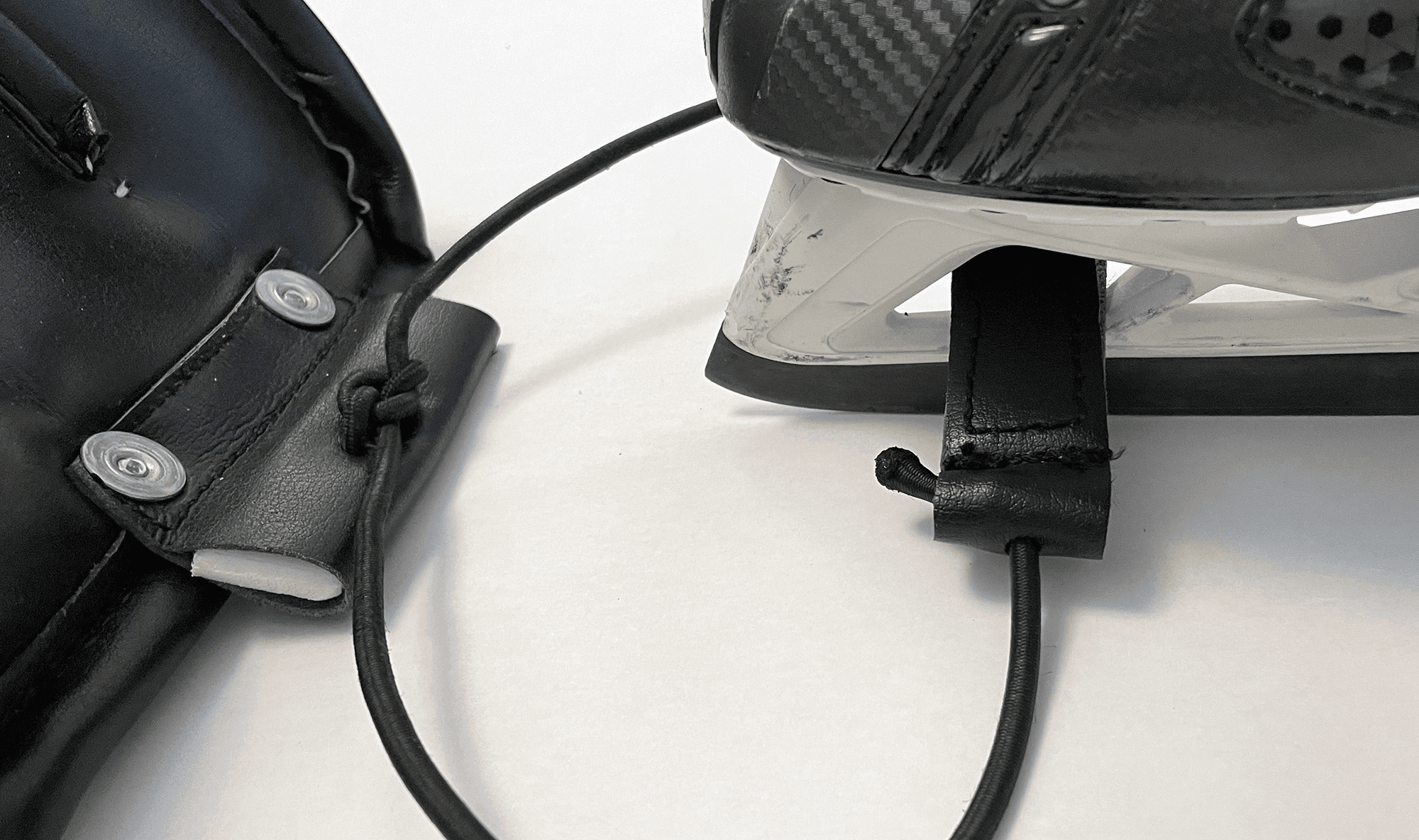 Feed velcro clasps through holes