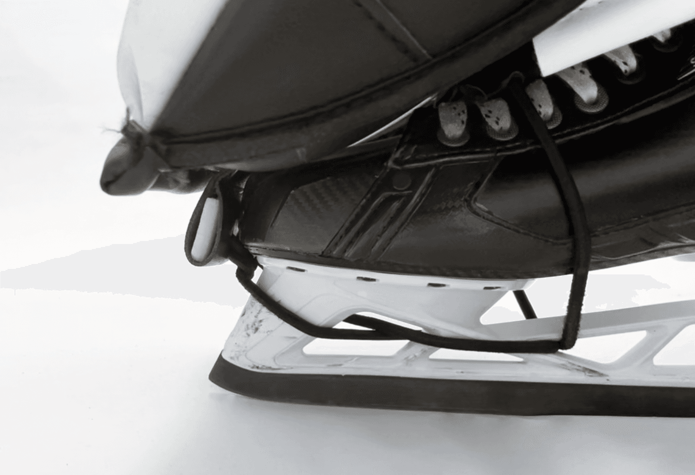 Leg pad secured to skate with bungee toe ties