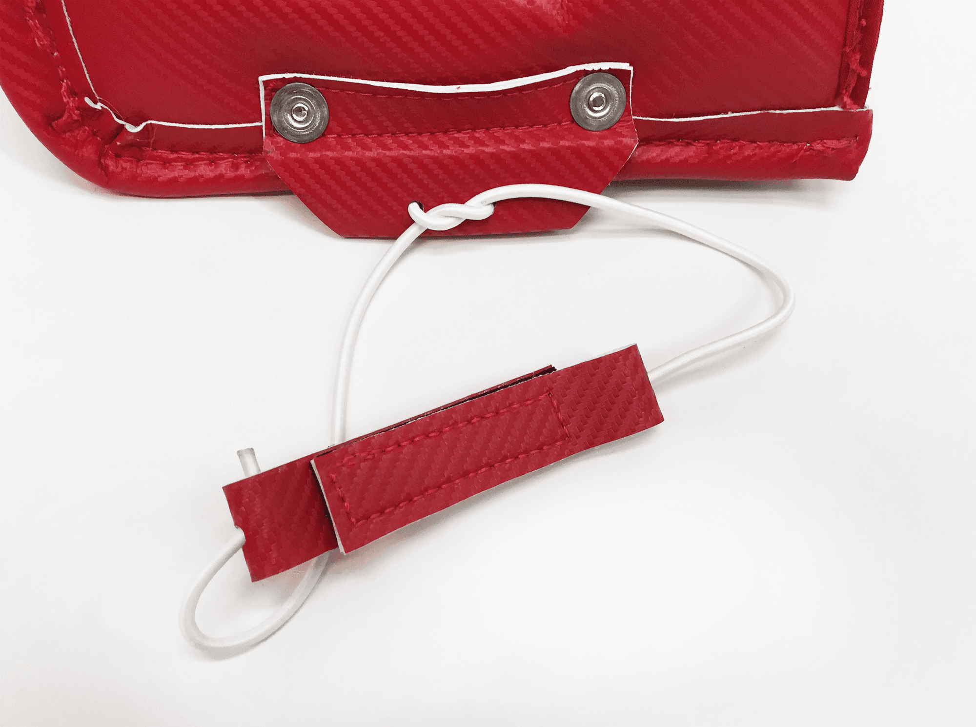 Bungee toe assembly attached to goalie pad